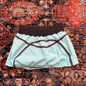 Lululemon tracker skirt. Turquoise and black with drawstring to adjust. Size 6!